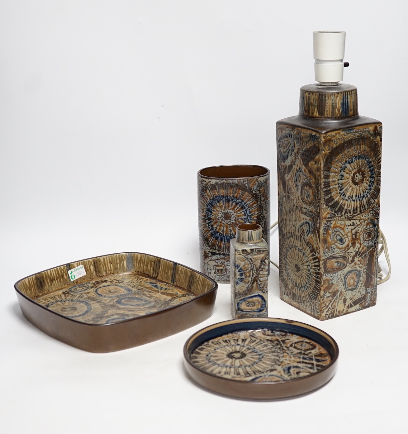 Five Royal Copenhagen fajance items; a lamp, two vases, and two shallow dishes, tallest 29cm